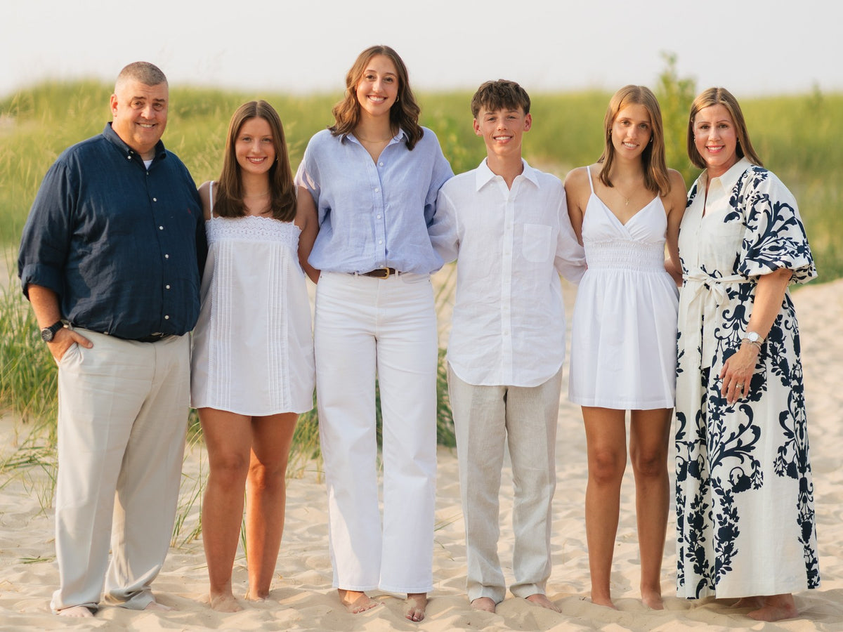 Julie with her husband and their four children on a Michigan beach